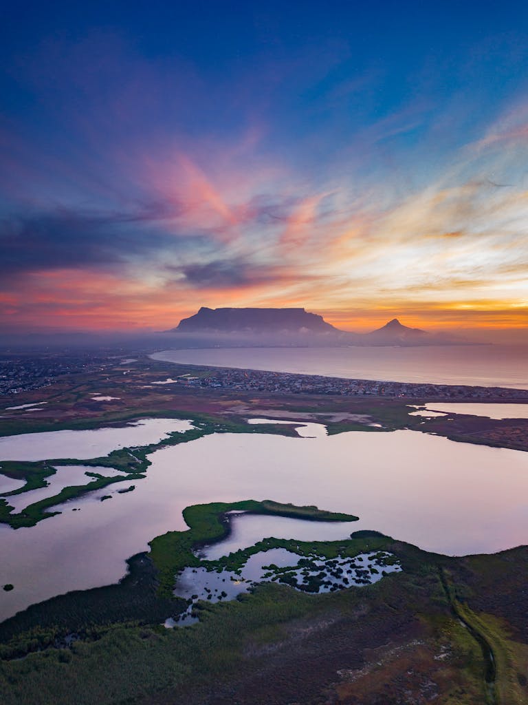 Amazing sunset over mountainous landscape with lakes and coastline